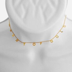 Gold choker necklace from Anthropologie NWT that says "heart of gold"